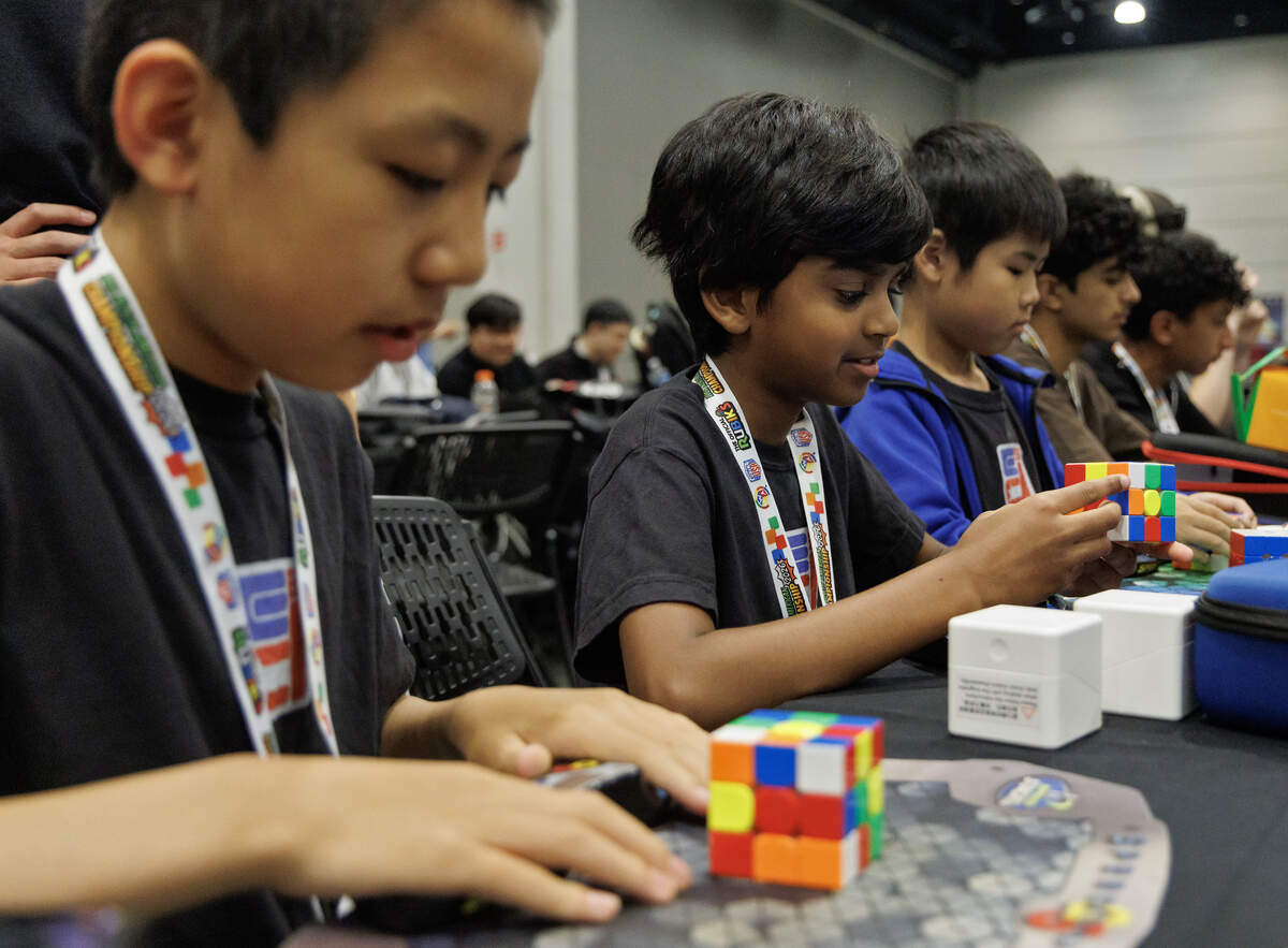 Kids practice solving cube puzzles during the Rubik’s WCA North American Championship at the Raleigh Convention Center on Thursday, July 2, 2026.