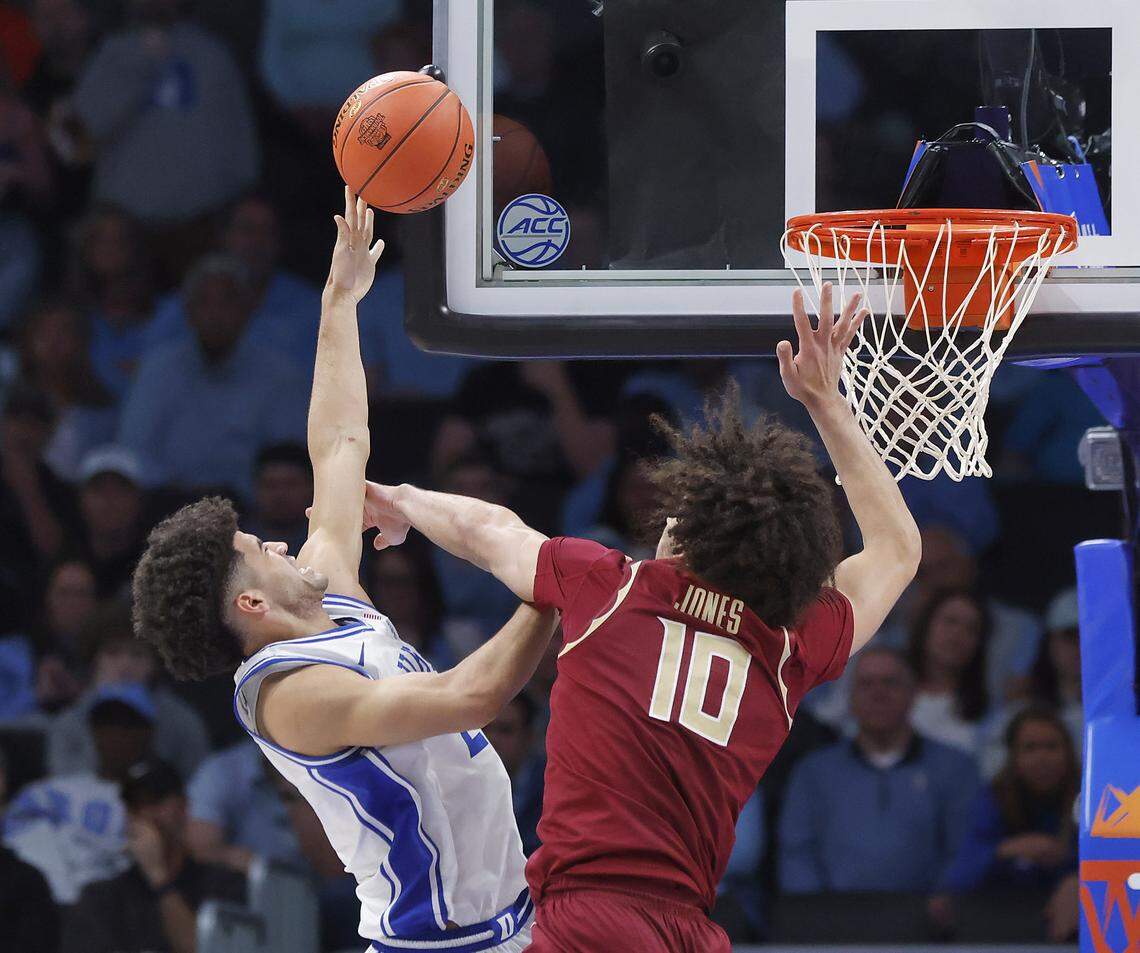 Duke’s Cayden Boozer drives to the basket against Florida State's Lajae Jones during the second half of the Blue Devils’ 80-79 win in the ACC Tournament quarterfinals on Thursday, March 12, 2026, at the Spectrum Center in Charlotte, N.C. 