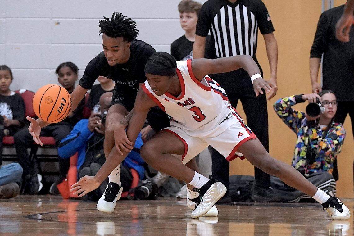 Greenfield's Kobe Edwards (3) makes the steal from Coronado's Demari Hunter (3) during the second half. The Greenfield Knights and the Coronado Cougars (Nevada) met in the finals of the Day'Ron Sharpe bracket of the  John Wall Holiday Tournament in Raleigh, N.C. on December 30, 2025.