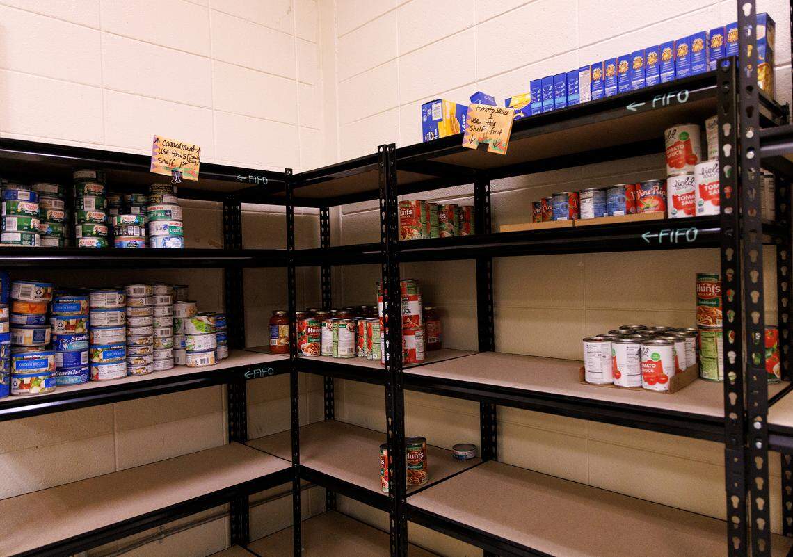 Nonperishable food items sit on a shelf at a pantry maintained by Porch Hillsborough on Thursday, Nov. 14, 2024, in Hillsborough, N.C. The organization has experienced lower-than-normal food collections since Hurricane Helene.