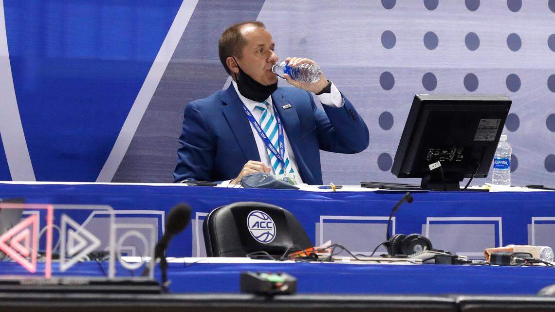 ACC Commissioner Jim Phillips takes a drink during a break in Duke’s 70-56 victory over Louisville in the second round of the ACC Men’s Basketball Tournament in Greensboro last week. Phillips will try to help the league’s lack of TV revenue by elevating football.