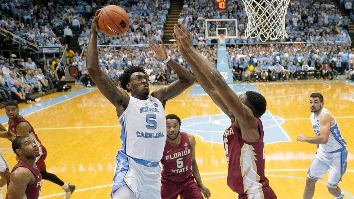 North Carolina’s Nassir Little (5) drives on Florida State’s Mfiondu Kabegnele (25) for a dunk during the first half on Saturday, February 23, 2019 at the Smith Center in Chapel Hill, N.C