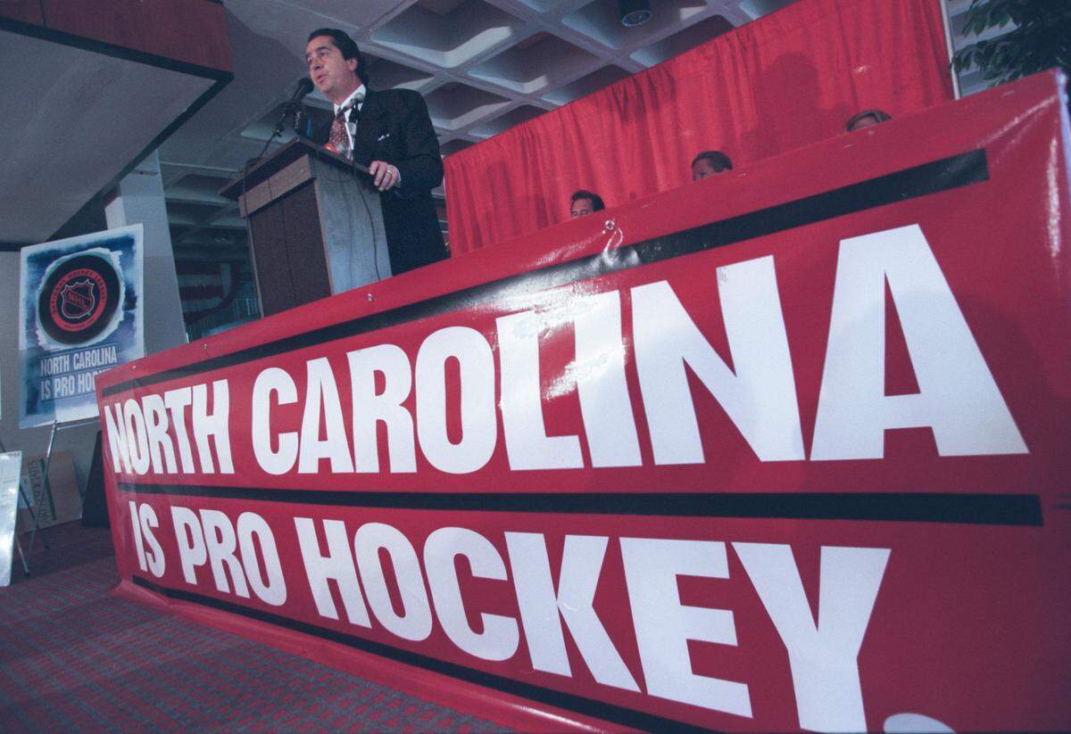Businessman Felix Sabates, was a leader in the 1996 drive to bring pro hockey to the Triangle. He is shown here speaking at a news conference in Carter-Finley Stadium, He admitted the NHL quest got off to a late start. “We’re a little behind the eight ball.”