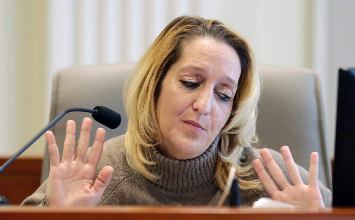 Lisa Britt throws up her hands as she answers a question by by attorney Marc Elias during the public evidentiary hearing on the 9th Congressional District investigation Monday, Feb. 18, 2019, at the North Carolina State Bar in Raleigh.