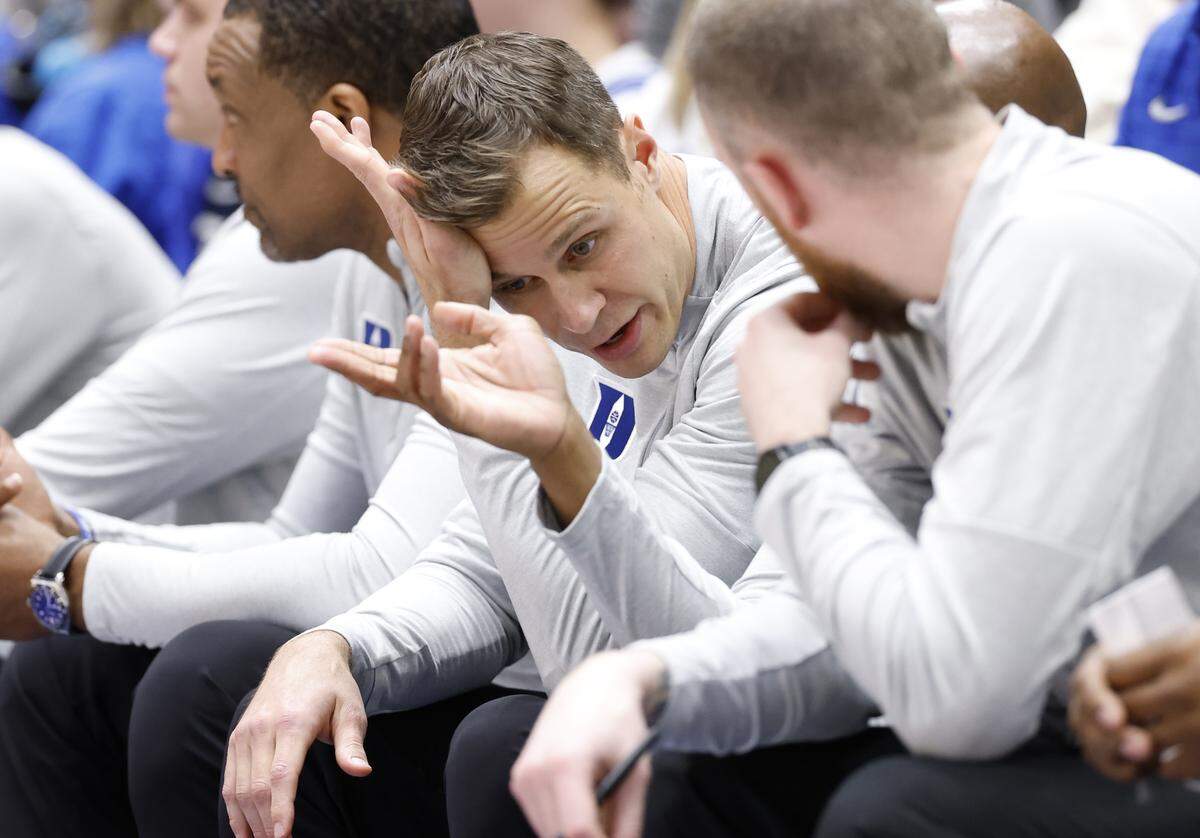 Duke head coach Jon Scheyer talks to his assistant coaches during the second half of Duke’s 82-75 victory over SMU at Cameron Indoor Stadium in Durham, N.C., Saturday, Jan. 10, 2026.