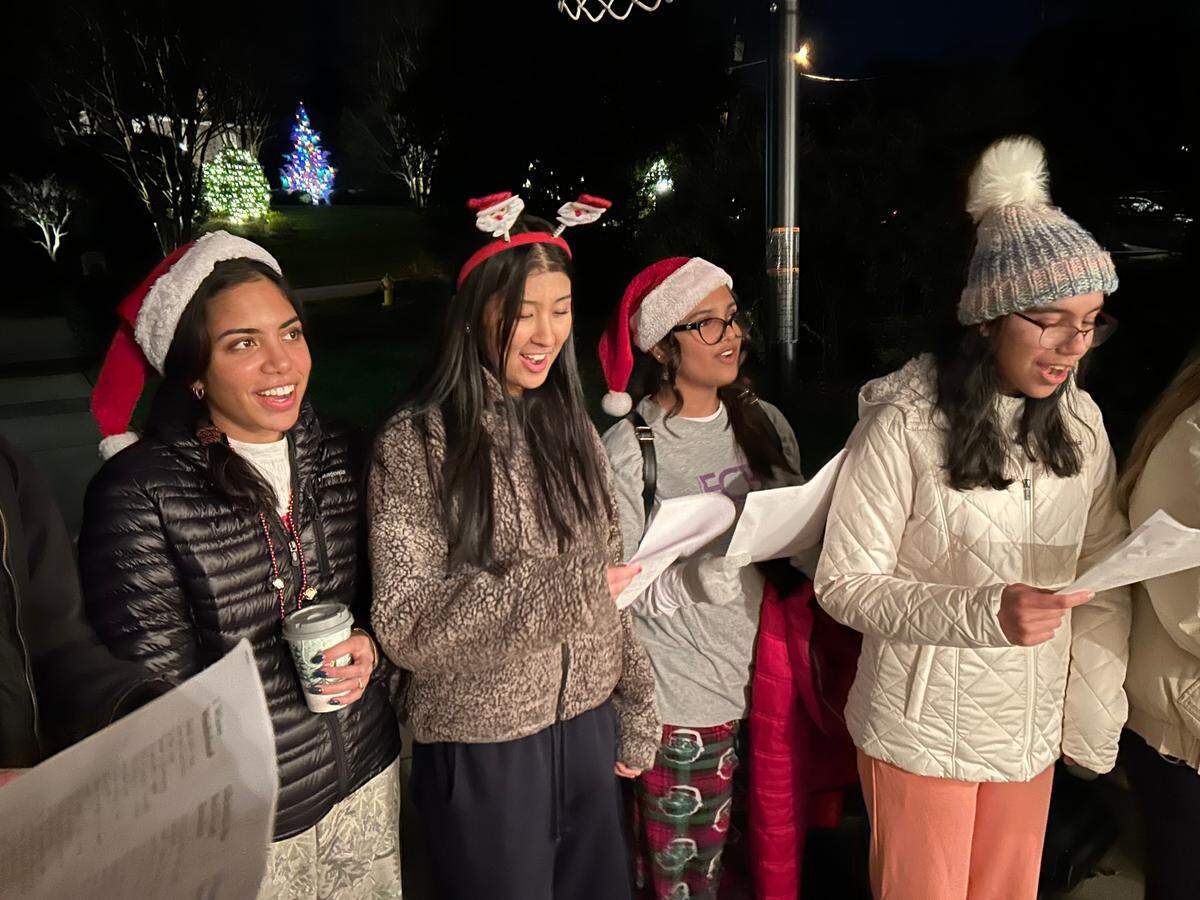 Enloe High School students Mimi Sonawane, Jiya Shu-Bhure, Aarna Saklaan and Riya Singh sing carols to raise money for the 2024 Enloe Charity Ball on Dec. 7, 2024 in Raleigh. N.C.