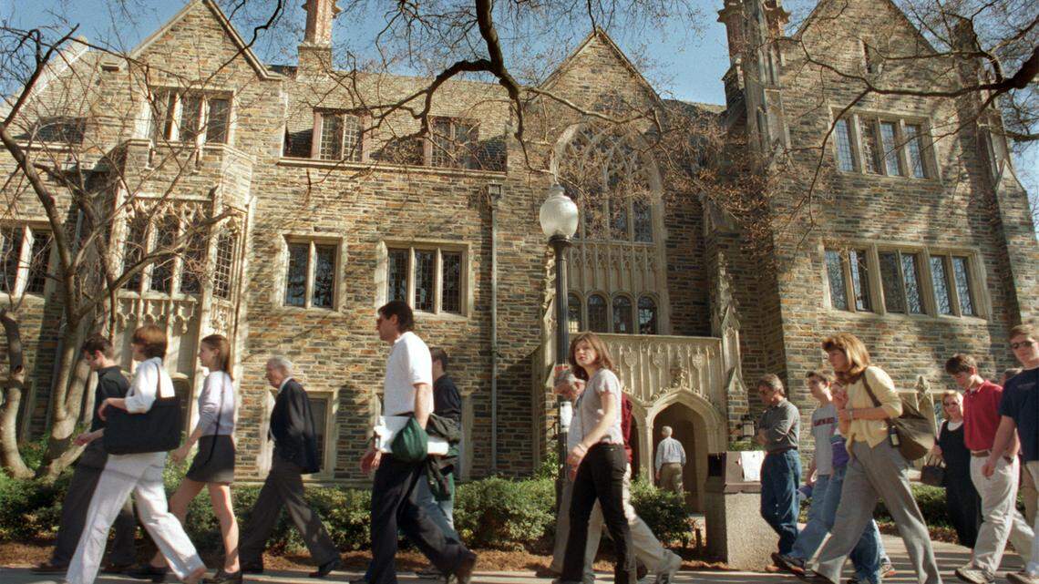 A Duke University student tour leads a group of undergraduate prospects on a tour of West Campus. Duke University announced Friday that it will no longer require the SAT essay or ACT writing scores for students applying for admissions.