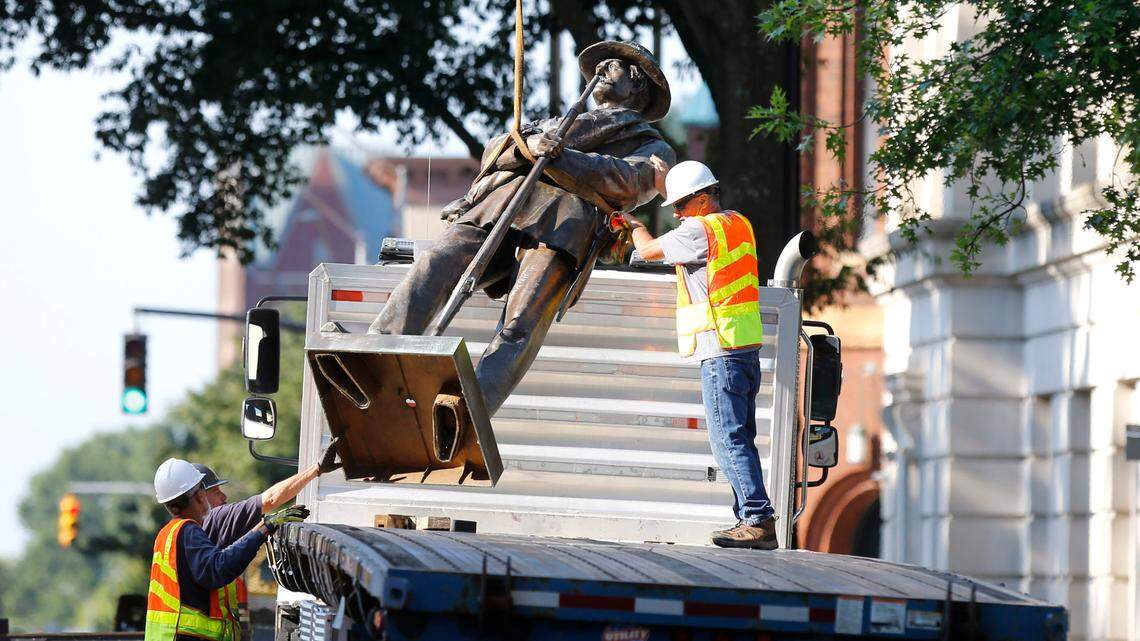 To cheers and music, workers dismantling 75-foot Confederate monument at NC Capitol