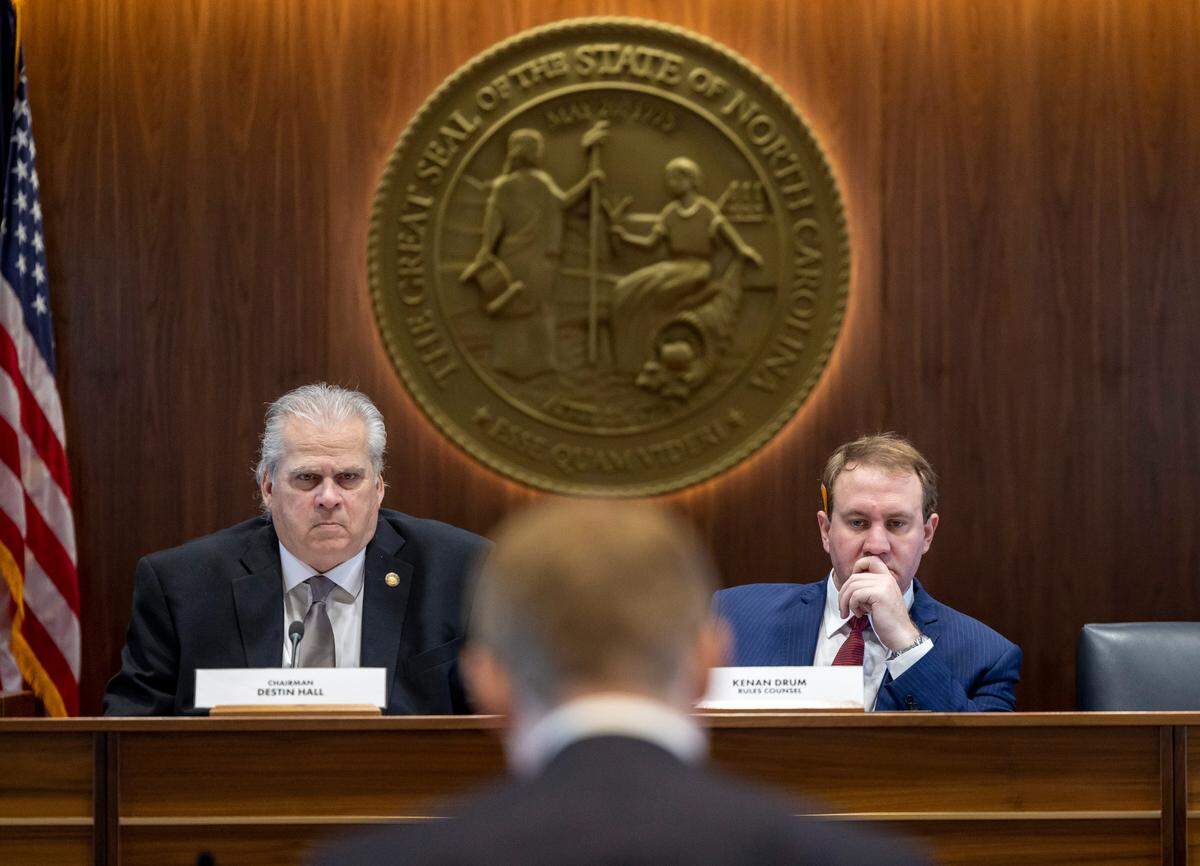 Rep. John Torbett, left, of Gaston County, presides over the House Rules Committee meeting, as he and Kenan Drum, the Rules Counsel, right, listen to Rep. Destin Hall, the sponsor of House Bill 898 Edition 2, who presented the redistricting map for the committee approval on Tuesday, October 24, 2023 in Raleigh, N.C.