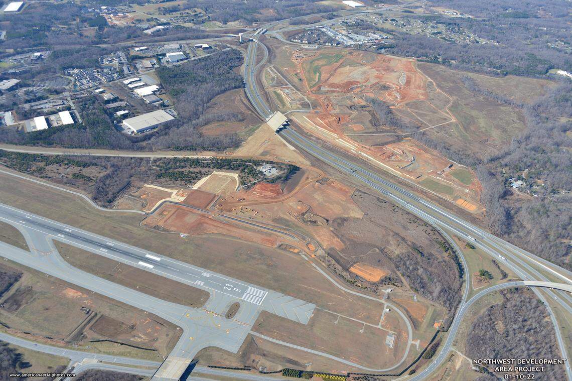 Boom Supersonic will build a jet factory on 65 acres between a runway at Piedmont Triad International Airport and Interstate 73, right. The white bridge over the interstate was built so planes can someday taxi to property the airport hopes to develop for aerospace companies across the highway.