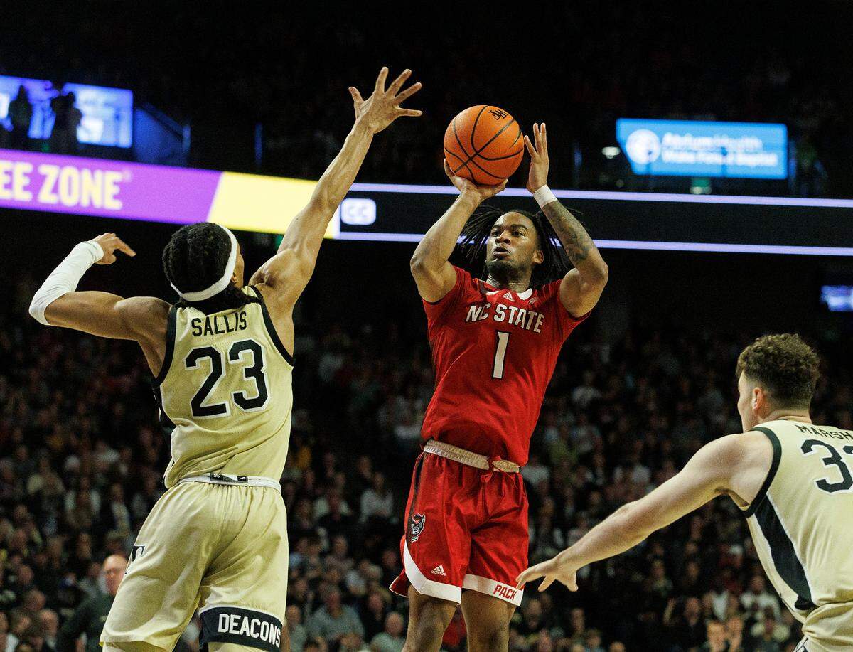 N.C. State’s Jayden Taylor shoots over Wake Forest’s Hunter Sallis during the second half of the Wolfpack’s 83-79 loss on Saturday, Feb. 10, 2024, at Lawrence Joel Veterans Memorial Coliseum in Winston-Salem, N.C.