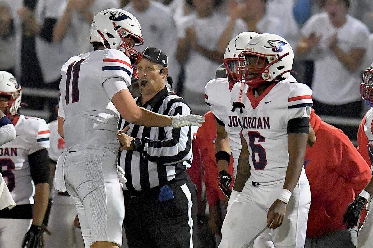 Jordan's Brayden Kern (11) and Ryan Smith (6) react to a play against Millbrook during the first half. The Millbrook Wildcats and the Jordan Falcons met in the third round of the NCHSAA 8A football playoffs in Raleigh, N.C. on November 21, 2025. 