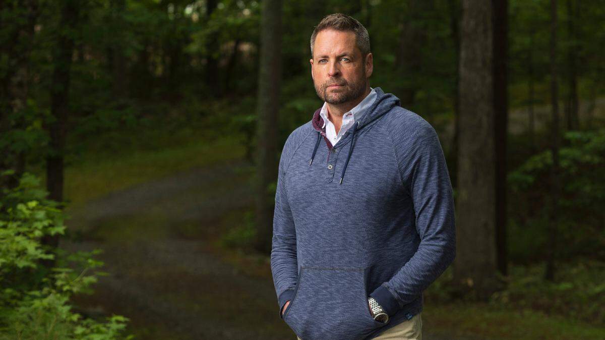 Aaron Ward, a three-time Stanley Cup Champion and member of the 2006 Carolina Hurricanes poses for a portrait on Friday, May 10, 2024 in Apex, N.C. During an interview Ward talks about overcoming a gambling addiction as North Carolina legalized gambling in 2024.