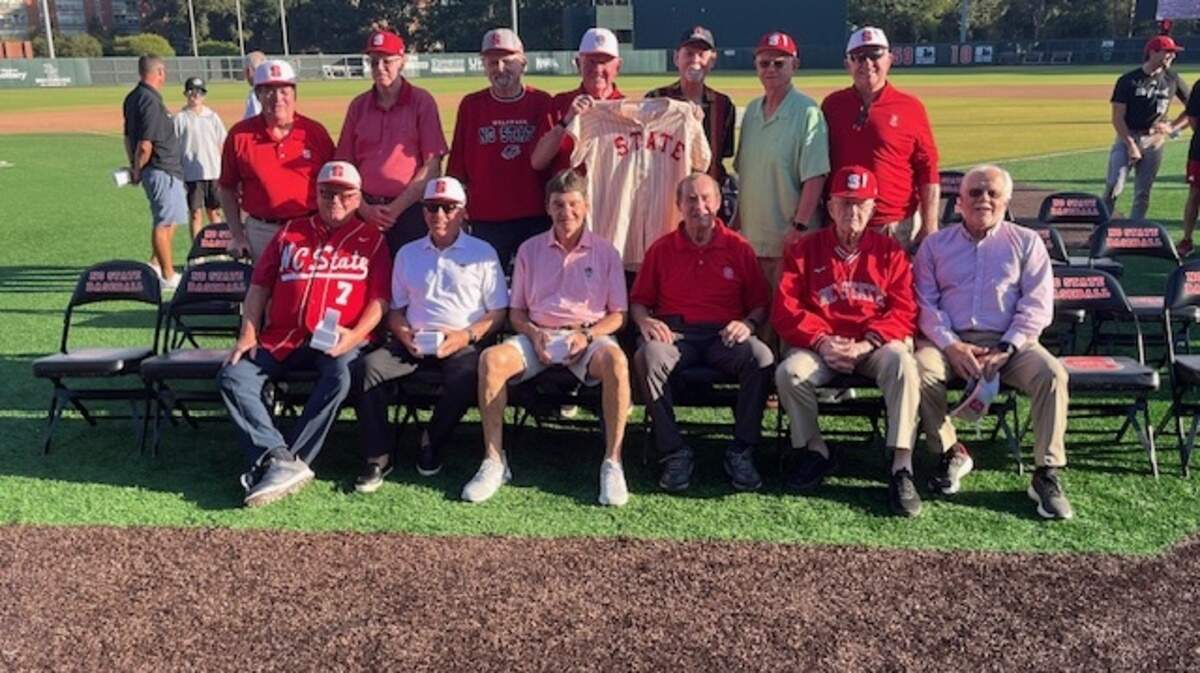 Members of NC State’s 1968 College World Series baseball team gather at Doak Field at Dail Park to receive commemorative rings on Oct. 3, 2025. 