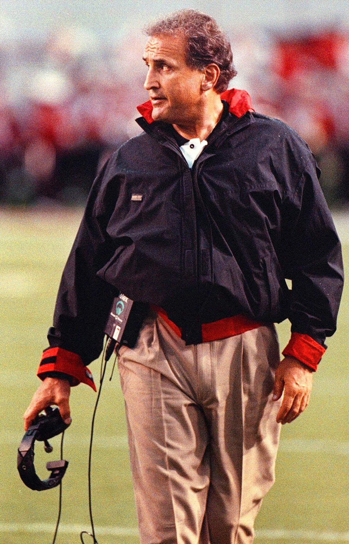 N.C. State coach Chuck Amato walks the sidelines during the game against Arkansas State on Sept 2, 2000, at Carter-Finley Stadium. Amato, a graduate of N.C. State in 1969, is in his first year of coaching at the university.