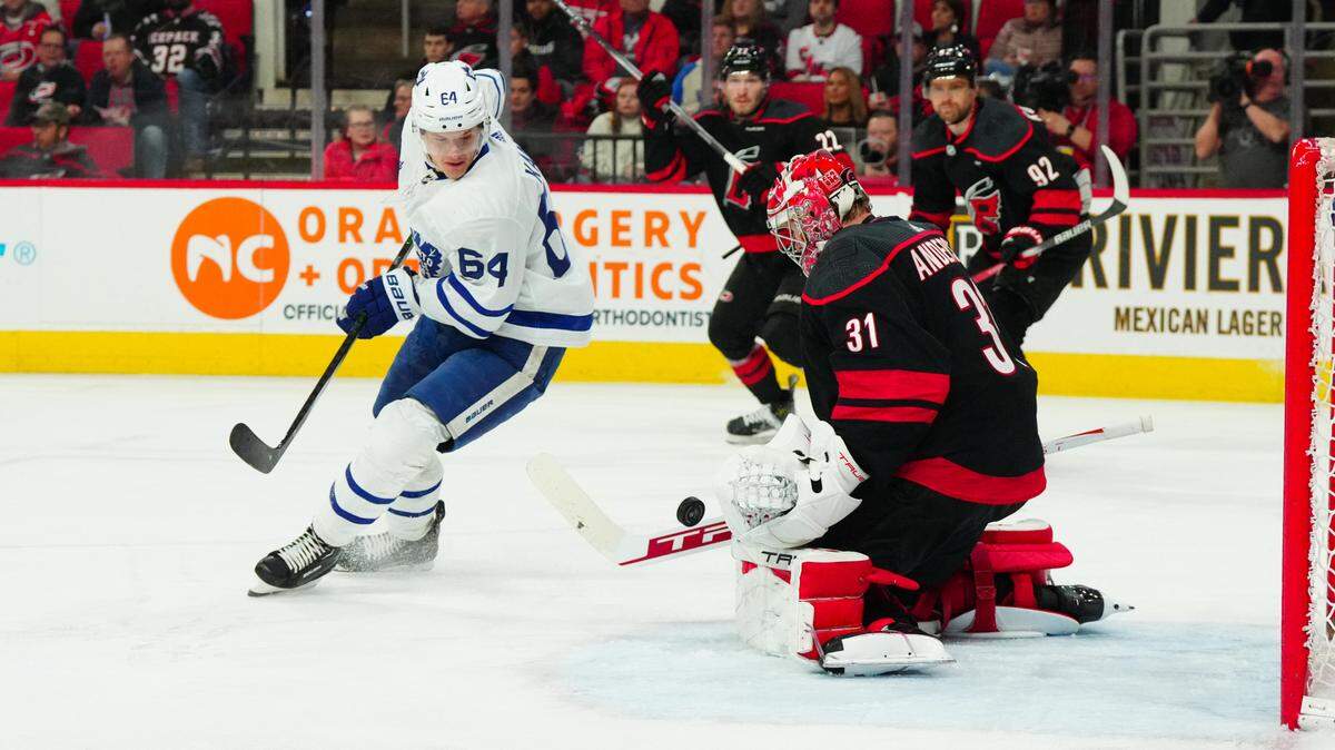 Carolina Hurricanes goaltender Frederik Andersen (31) stops the shot in front of Toronto Maple Leafs center David Kampf (64) during the second period at PNC Arena.
