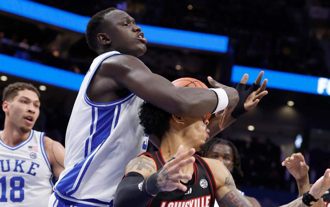 Duke’s Khaman Maluach (9) pulls in the rebound from Louisville’s Terrence Edwards Jr. (5) during the first half of Duke’s game against Louisville in the finals of the 2025 ACC Men’s Basketball Tournament at the Spectrum Center in Charlotte, N.C., Saturday, March 15, 2025.