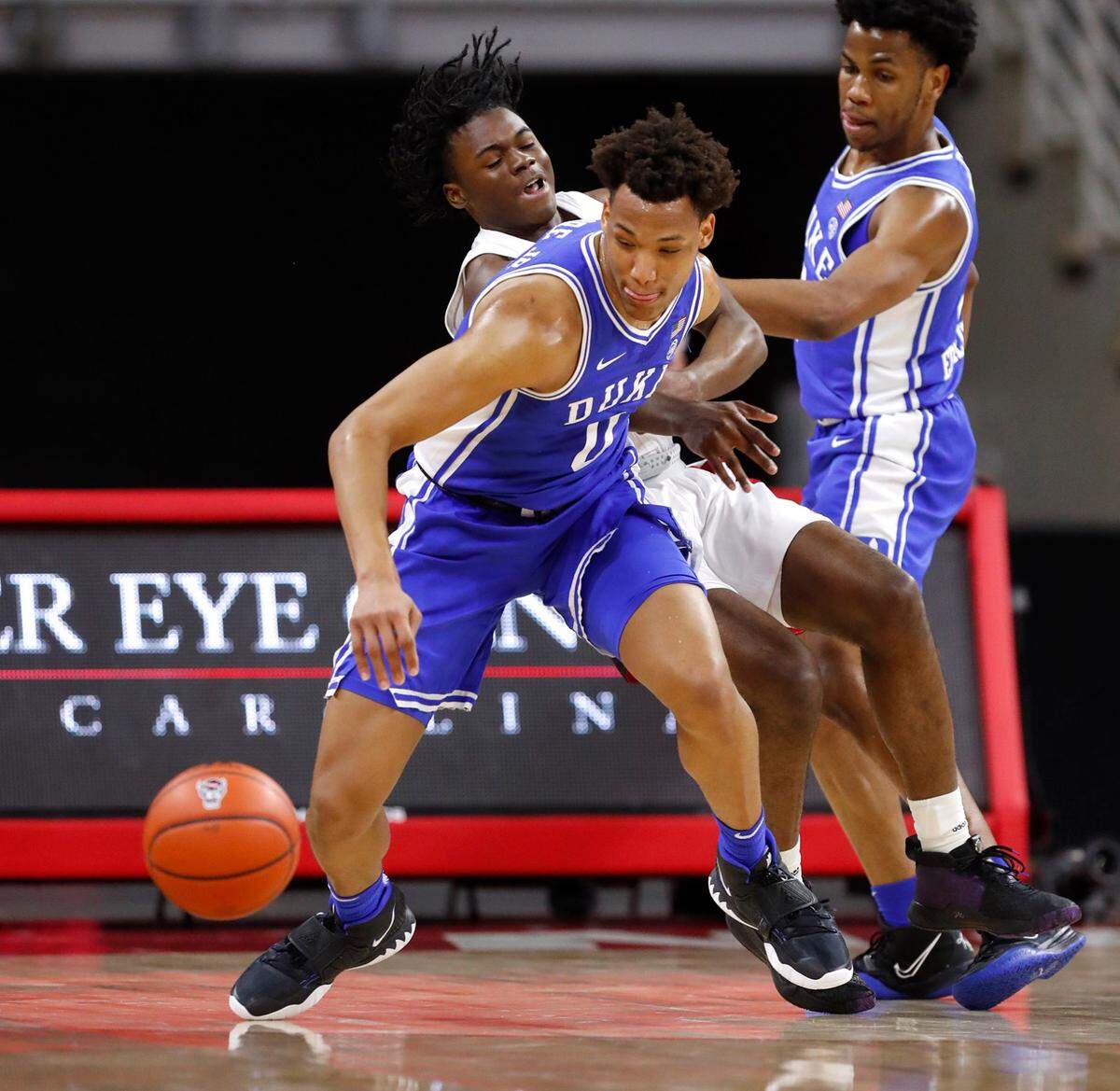 Duke’s Wendell Moore Jr. (0) steals the ball from N.C. State’s Cam Hayes (3) during the first half of N.C. State’s game against Duke at PNC Arena in Raleigh, N.C., Saturday, February 13, 2021.
