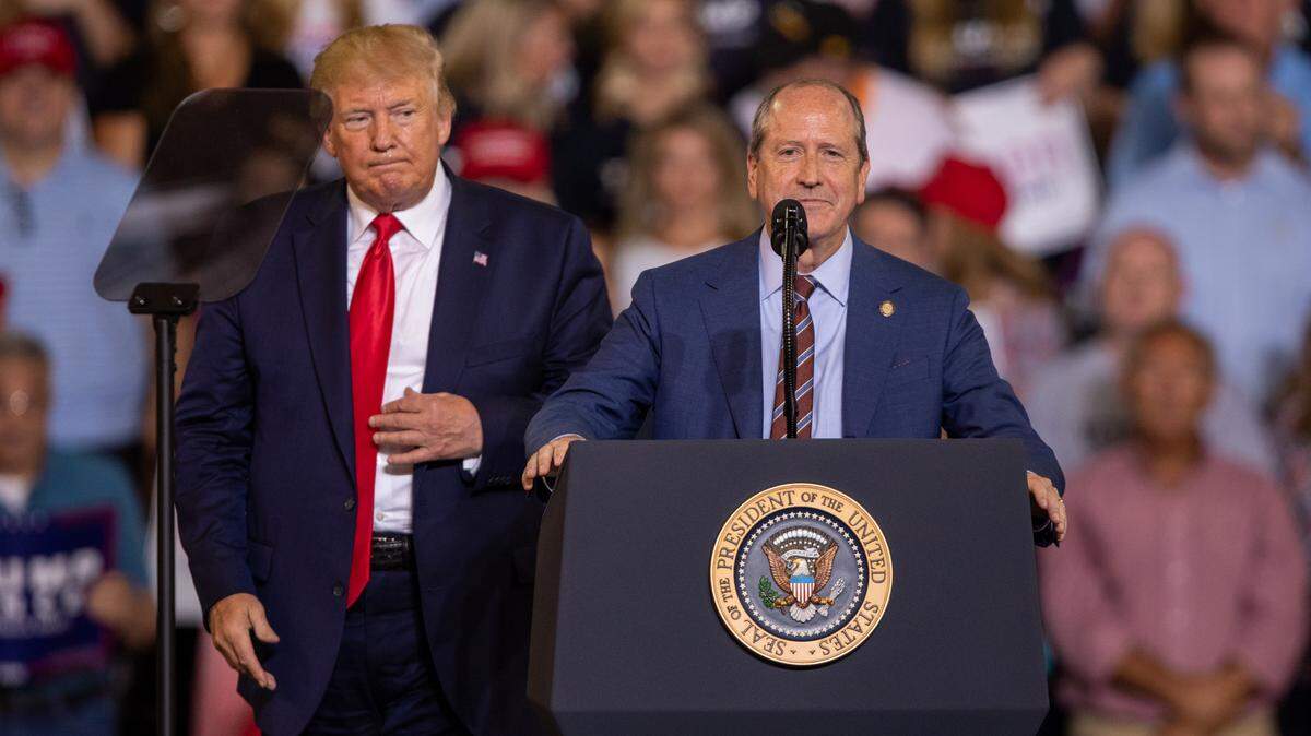 Dan Bishop, then a state senator from Mecklenburg County, speaks alongside President Donald Trump in Greenville in a 2019 file photo.