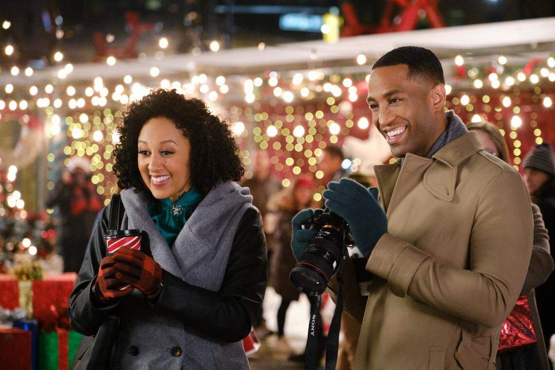 Tamera Mowry-Housley, left, and Brooks Darnell in “A Christmas Miracle” on Hallmark Movies & Mysteries.