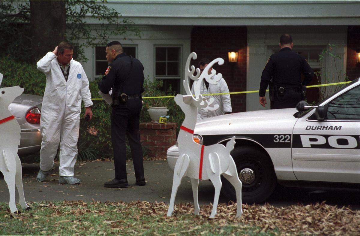 Durham police officers and investigators at the home of Kathleen and Michael Peterson at 1810 Cedar St. in the Forest Hills section of Durham.