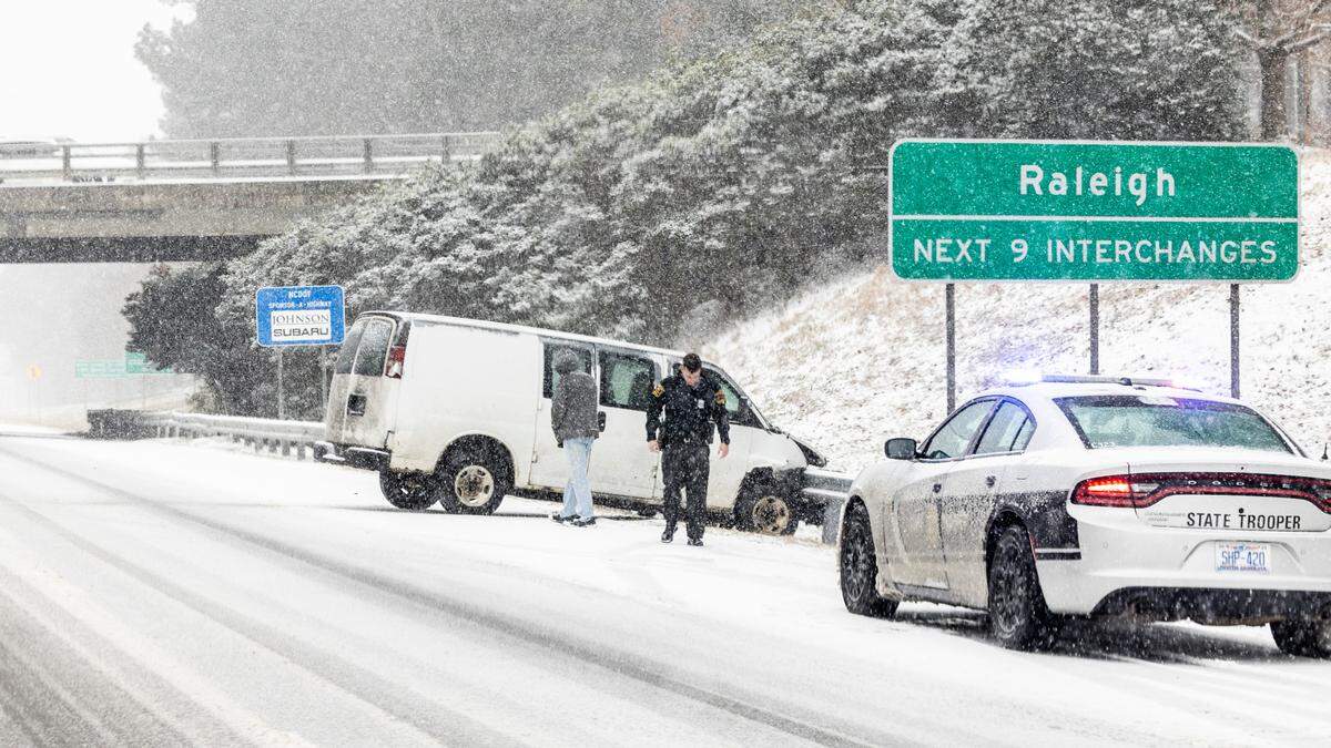 A NC Highway Patrol officer works the scene of a disabled vehicle on I-40 in Raleigh on Wednesday, Feb. 19, 2024.