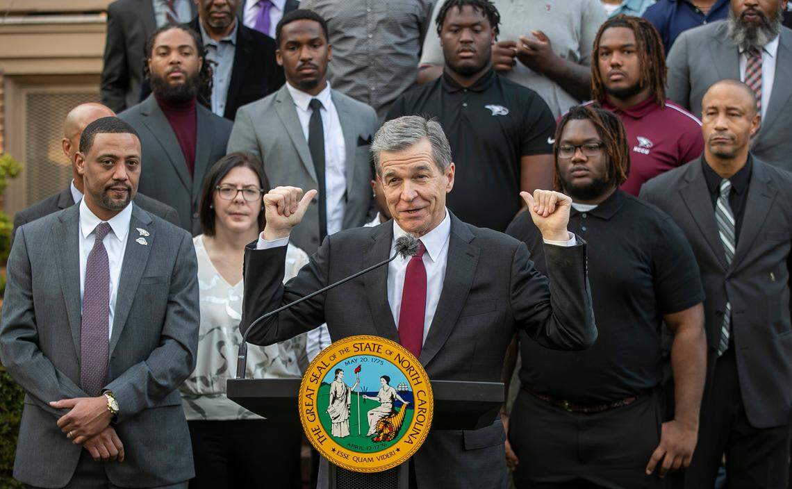 North Carolina Gov. Roy Cooper recognizes the N.C. Central football team’s 2022 HBCU National Championship, with head coach Trei Oliver, left, during a reception on the lawn of the Executive Mansion on Wednesday, Feb. 15, 2023, in Raleigh.