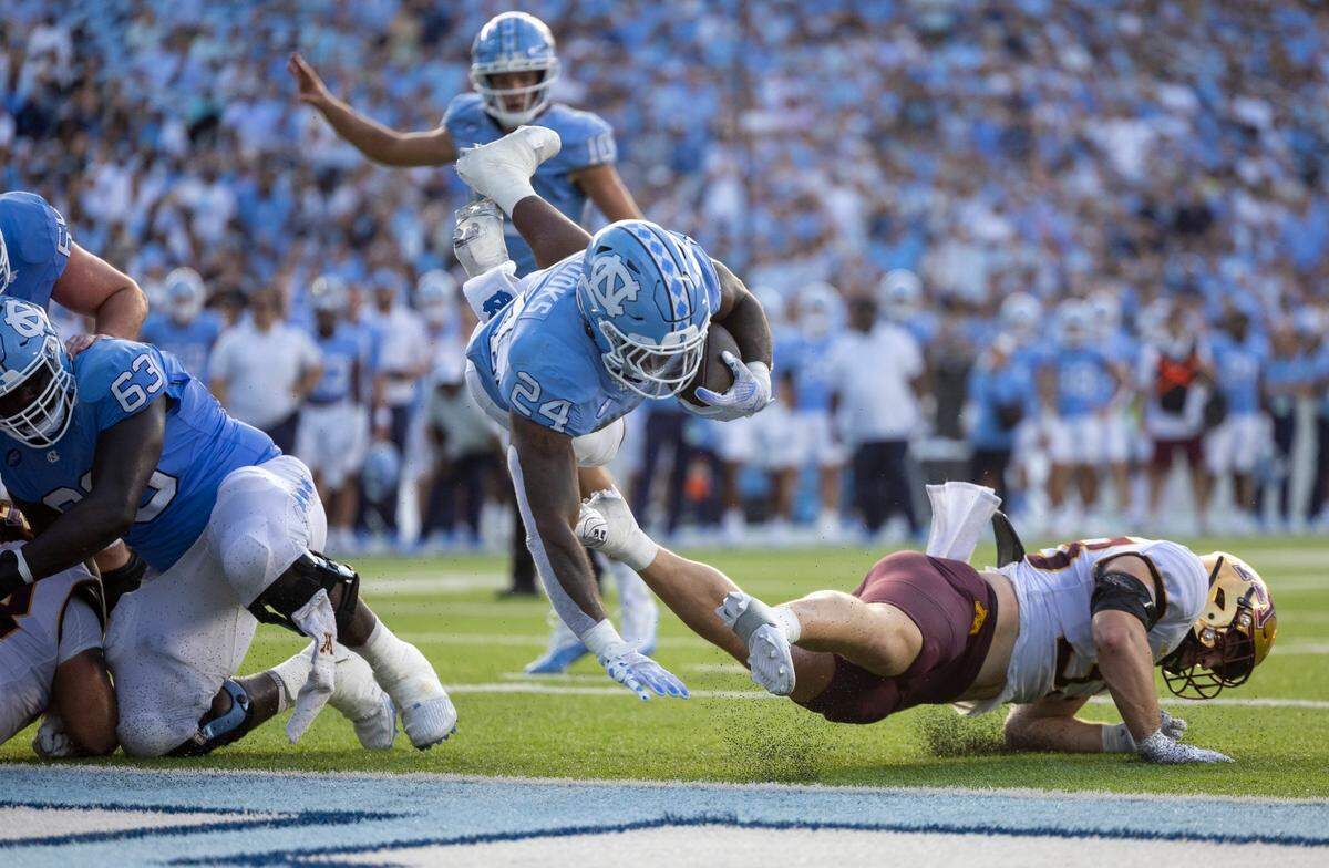 North Carolina running back British Brooks (24) scores on a one-yard run in the fourth quarter to secure the Tar Heels’ 31-13 victory over Minnesota on Saturday, September 16, 2023 at Kenan Stadium in Chapel Hill N.C.