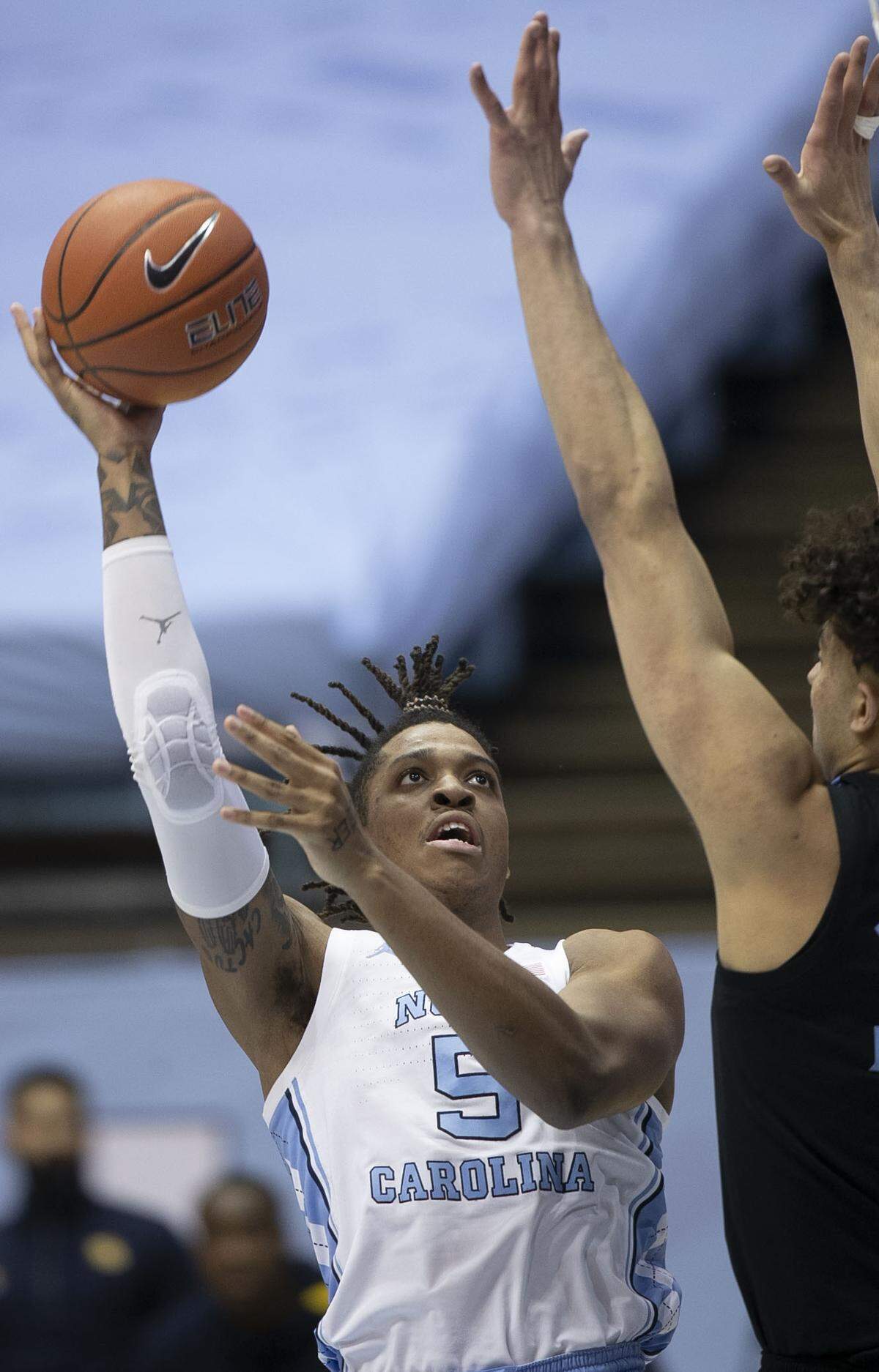 North Carolina’s Armando Bacot (5) puts up a shot against Marquette’s Dawson Garcia (33) during the first half on Wednesday, February 24, 2021 at the Smith Center in Chapel Hill, N.C.
