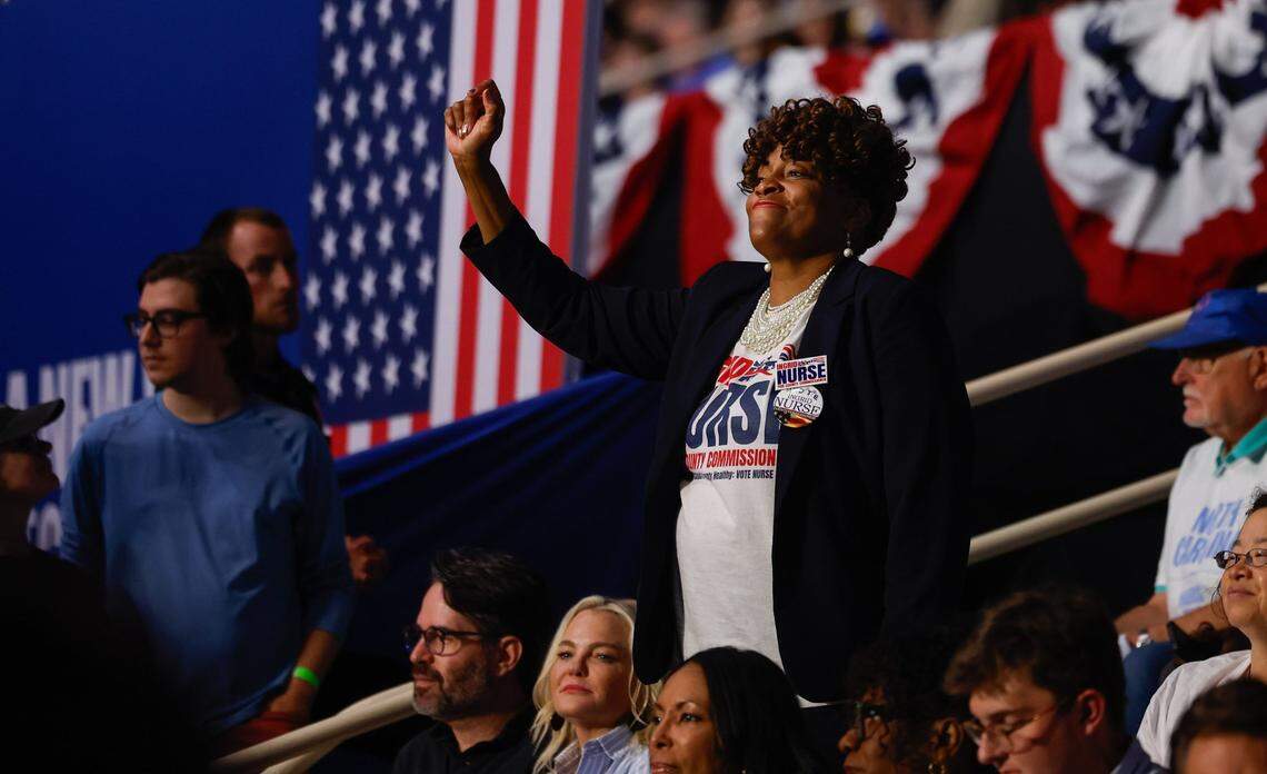 A supporter dances in the stands before Vice President Kamala Harris as she speaks during a rally at the Bojangles Coliseum in Charlotte, NC on Thursday, September 12, 2024.