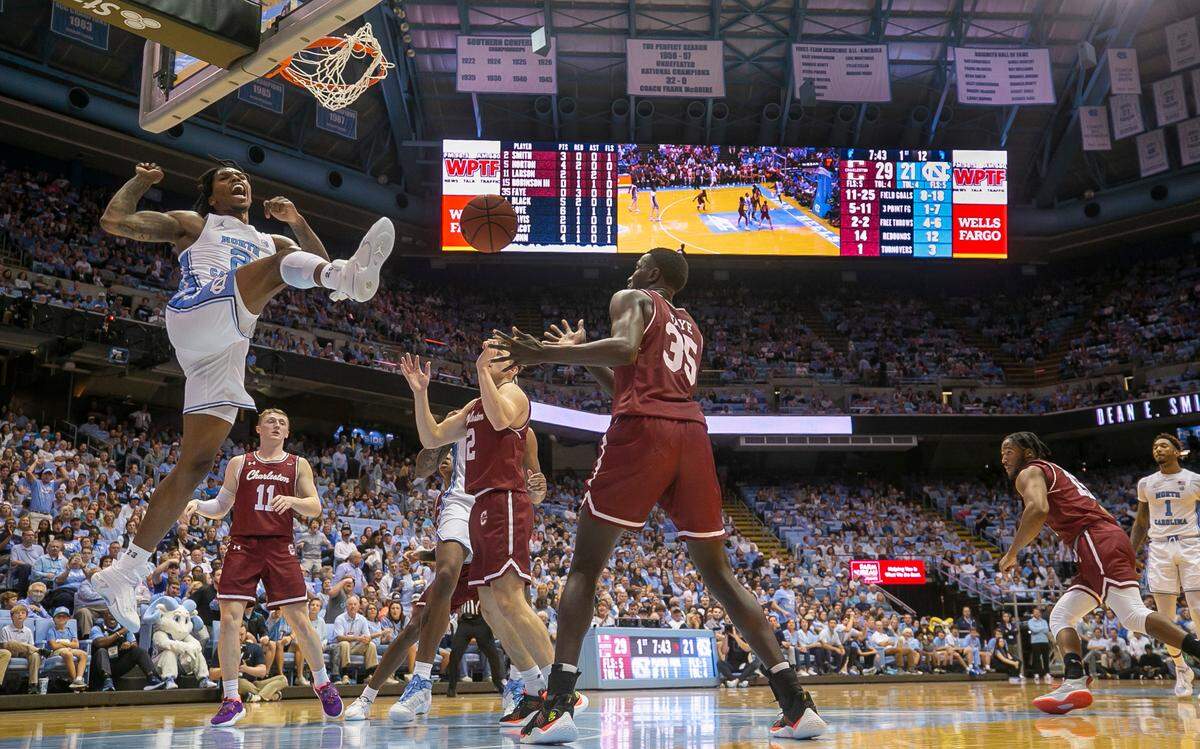 North Carolina’s Caleb Love (2) reacts after a dunk against College of Charleston’s Reyne Smith (2) during the first half on Friday, November 11, 2022 at the Smith Center in Chapel Hill, N.C.