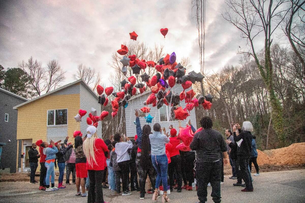 Mourners release balloons Thursday, Dec. 16, 2021 in Durham at the site of a Monday morning shooting that left two teenagers dead and four other children injured.