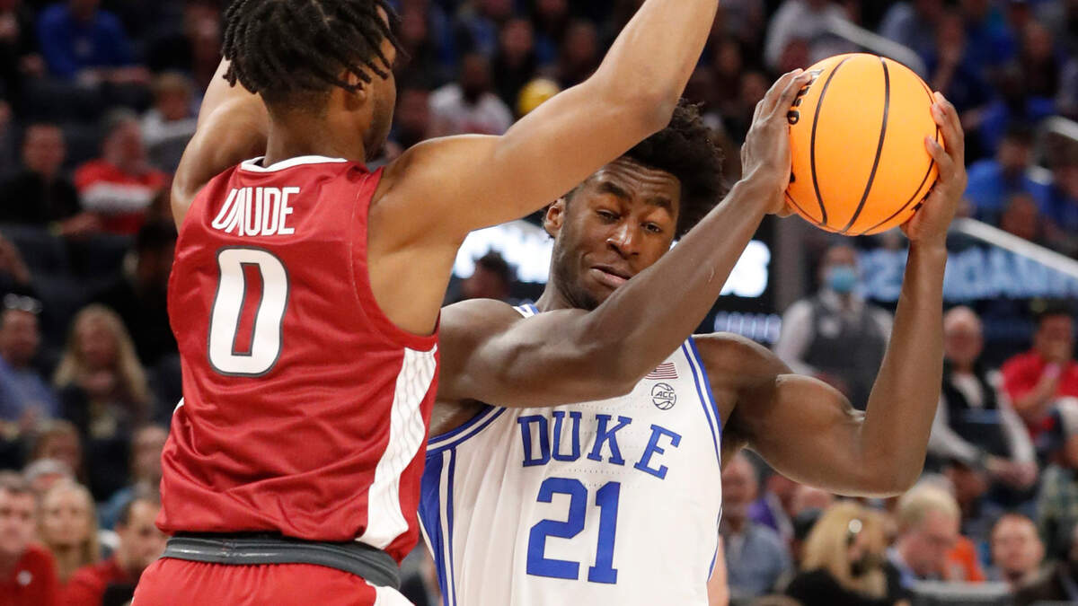Dukeís AJ Griffin (21) looks for room around Arkansas’ Stanley Umude (0) during the first half of Dukeís game against Arkansas in the NCAA Tournament West Regional finals at the Chase Center in San Francisco, Calif., Saturday, March 26, 2022.
