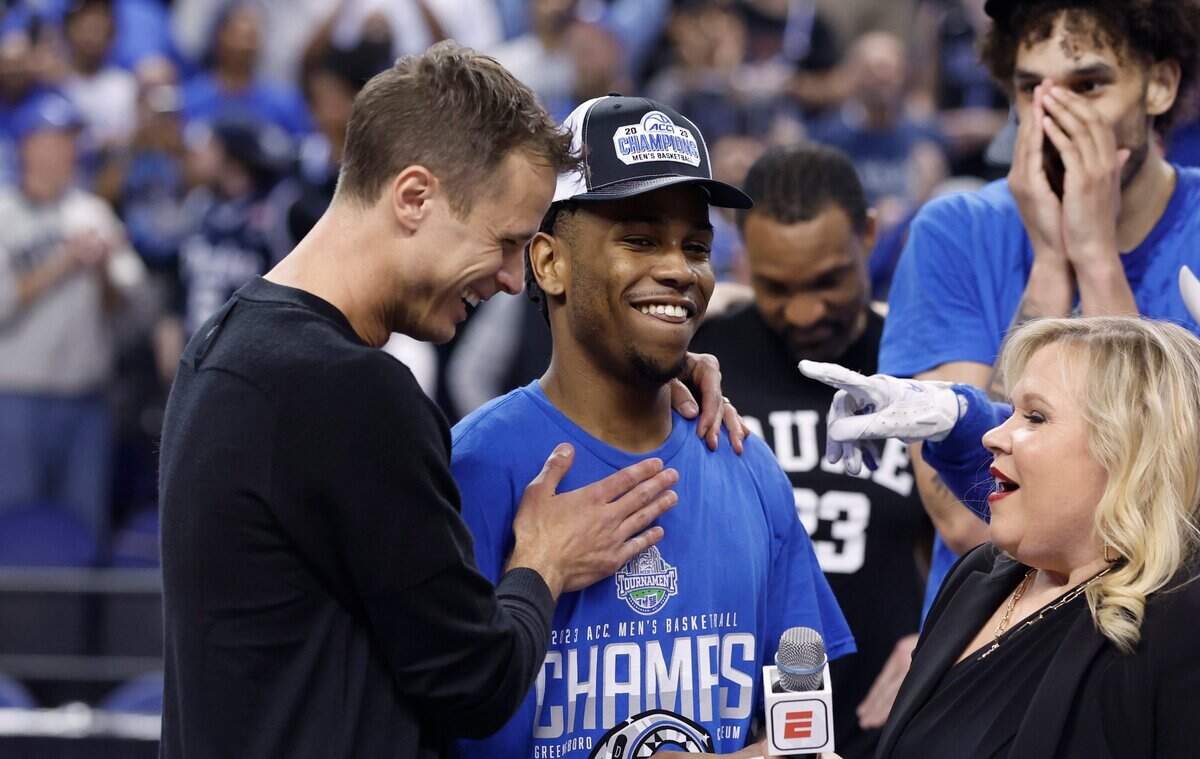 Duke head coach Jon Scheyer laughs with Jeremy Roach (3) after Duke’s 59-49 victory over Virginia to win the ACC Men’s Basketball Tournament in Greensboro, N.C., Saturday, March 11, 2023.