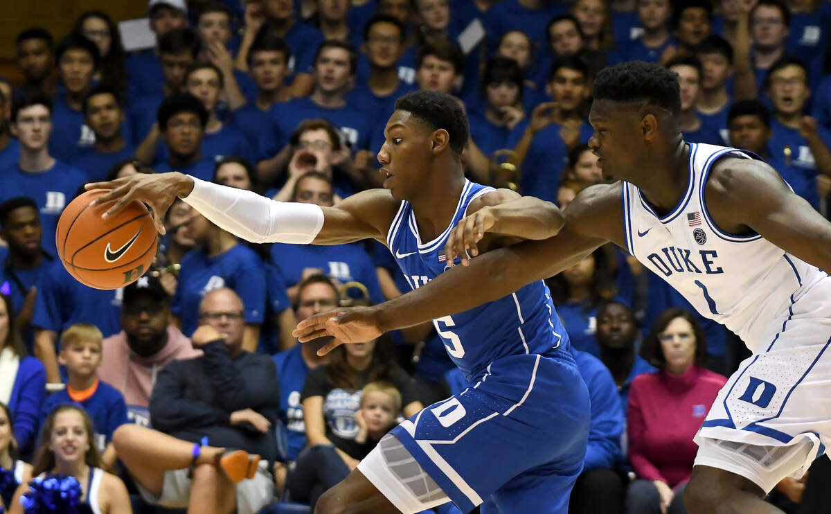 Duke’s RJ Barrett (5) and Zion Williamson (1) race for a loose ball at the Blue-White game during Countdown to Craziness at Cameron Indoor Stadium In Durham, N.C. Friday, Oct. 19, 2018.