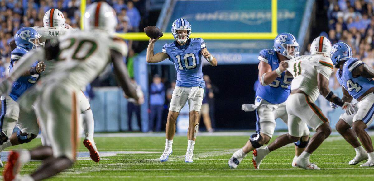 North Carolina quarterback Drake Maye (10) looks for an open receiver in the third quarter against Miami on Saturday, October 14, 2023 at Kenan Stadium in Chapel Hill, N.C. Maye passed for 273 yards and four touchdowns in the Tar Heels’ 41-31 victory.