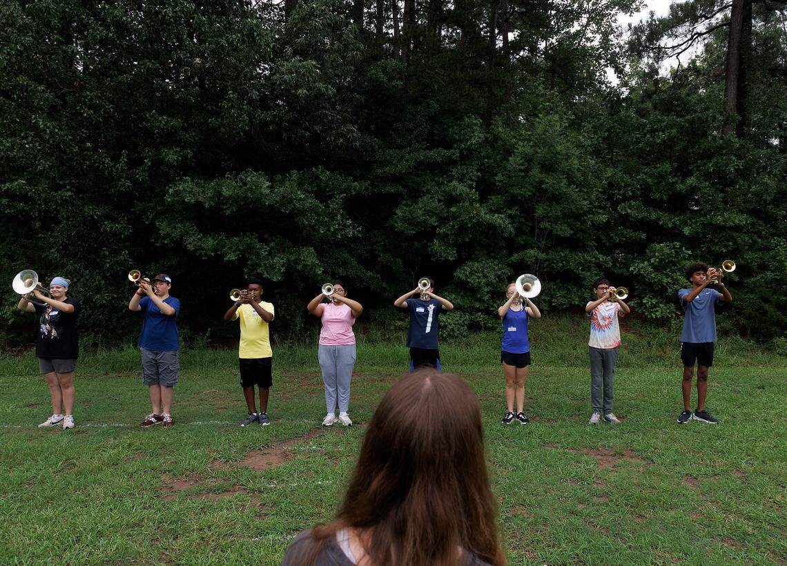Junior Cora Russell leads the high brass section during the first day of marching band camp at Jordan High School on Monday, July 22, 2024, in Durham, N.C.