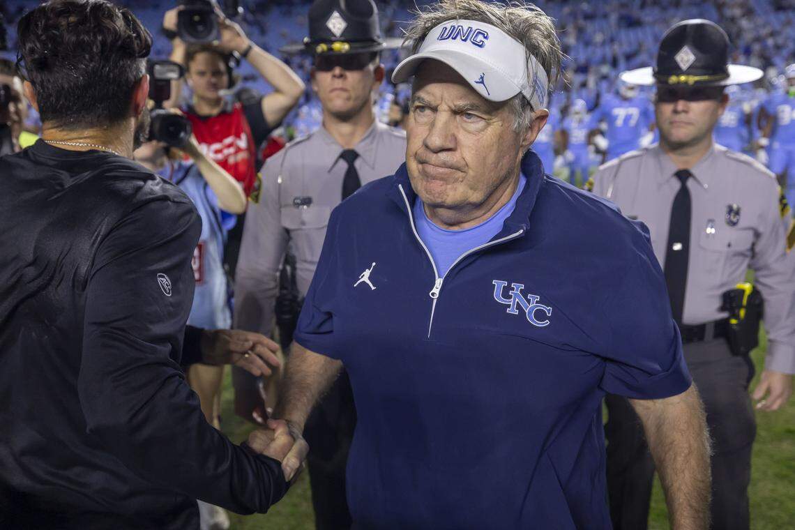 North Carolina coach Bill Belichick shakes hands with Duke coach Manny Diaz following the Blue Devils’ 32-25 victory on Saturday, November 22, 2025 at Kenan Stadium in Chapel Hill, N.C.