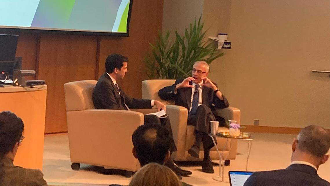 John Podesta, the Biden administration’s top climate diplomat, speaks with Duke University business professor Ronnie Chatterji at a summit Wednesday at Duke’s Fuqua School of Business. The conference focused on the Inflation Reduction Act, a bill meant to catalyze investments in cleaner energy.