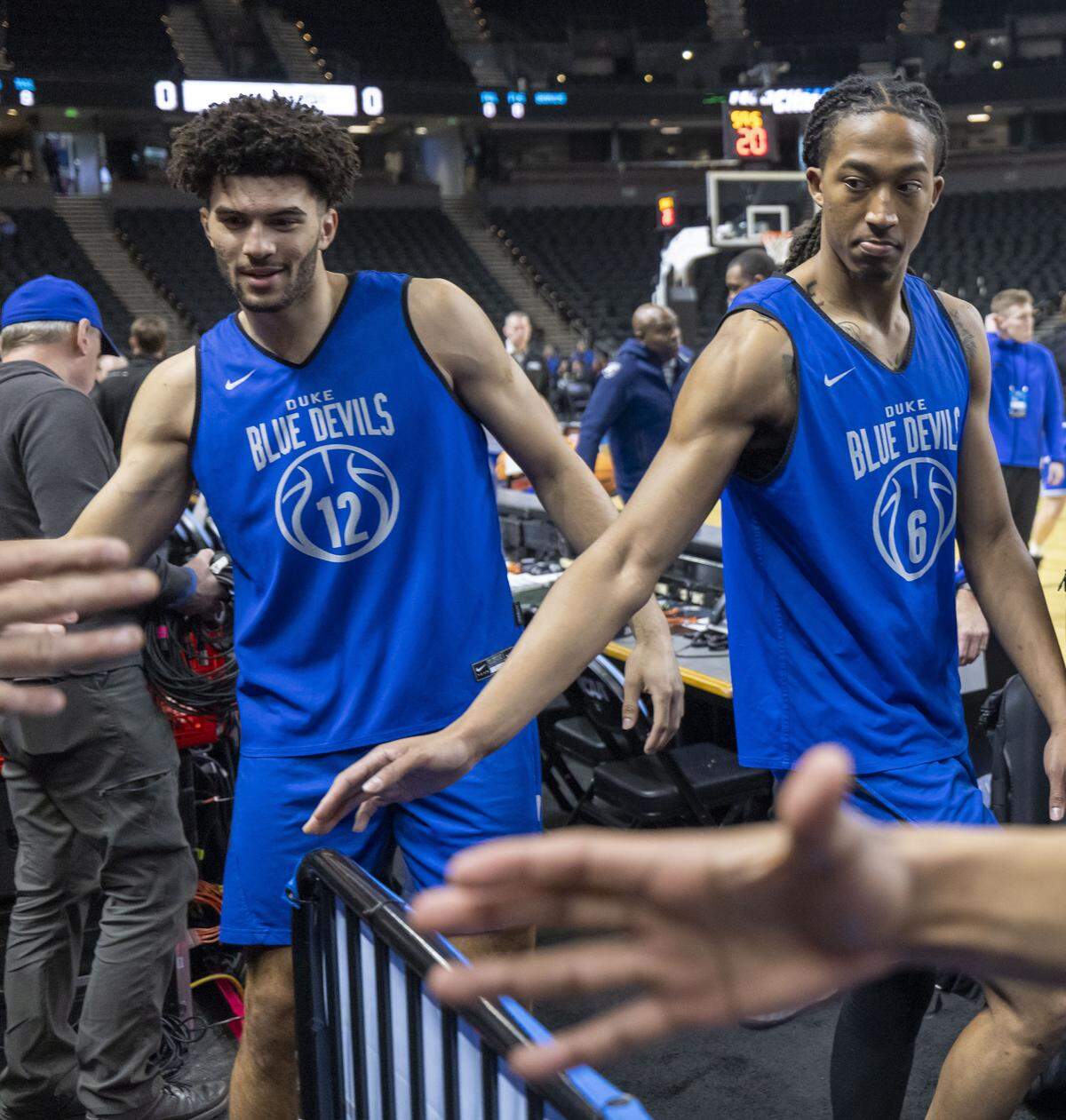 Duke forwards Cameron Boozer (12) and Maliq Brown (6) greet fans following the Blue Devils’ practice on Wednesday, March 18, 2026, at Bon Secours Arena on Greenville, S.C. 