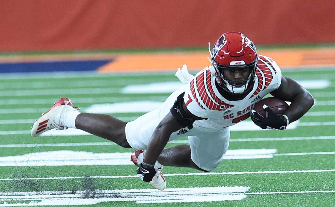 North Carolina State Wolfpack running back Zonovan Knight (7) falls forward for extra yards during a game against Syracuse on Saturday, Nov. 28, 2020, at the Carrier Dome in Syracuse, N.Y.