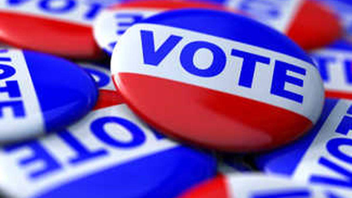 Buttons encouraging people to vote are shown in a file photo.