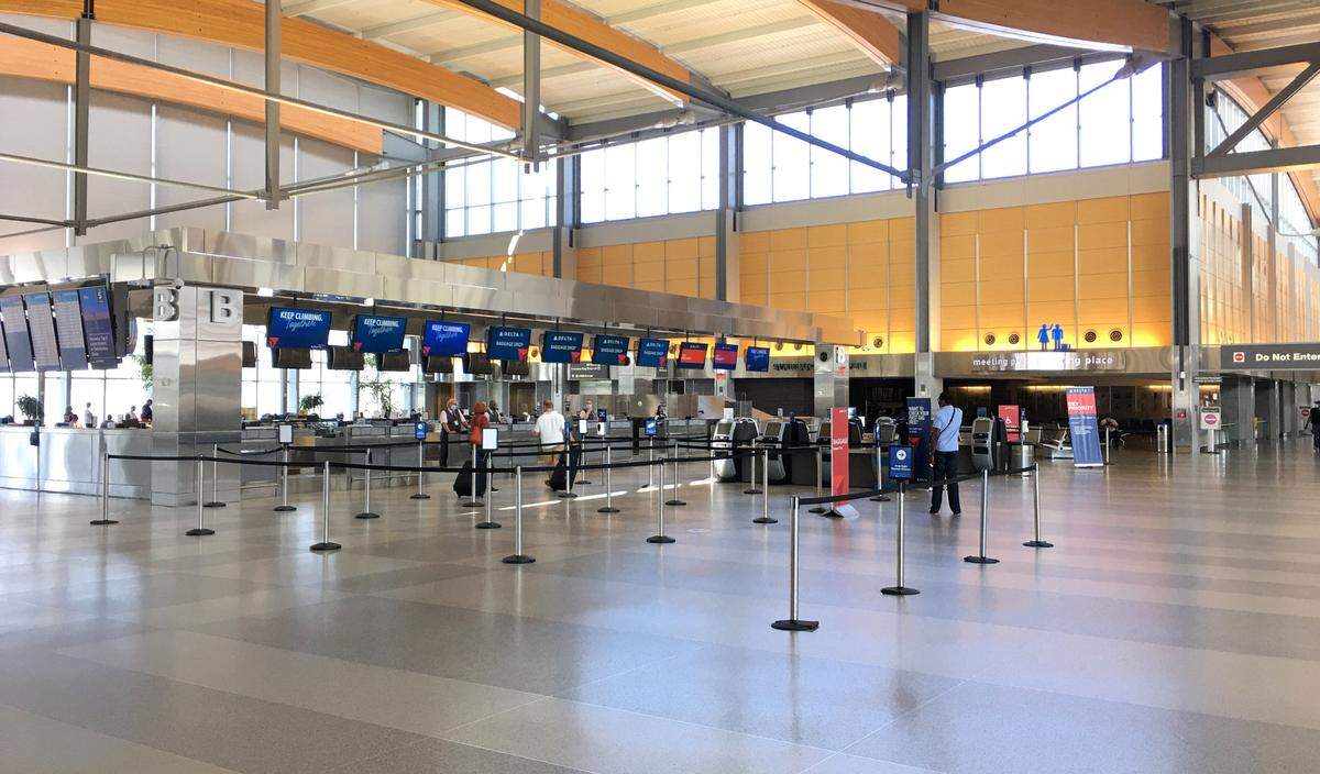 There are very few people at the Delta check-in area in Terminal 2 at Raleigh-Durham International Airport Wednesday morning around 10 a.m., August 12, 2020.