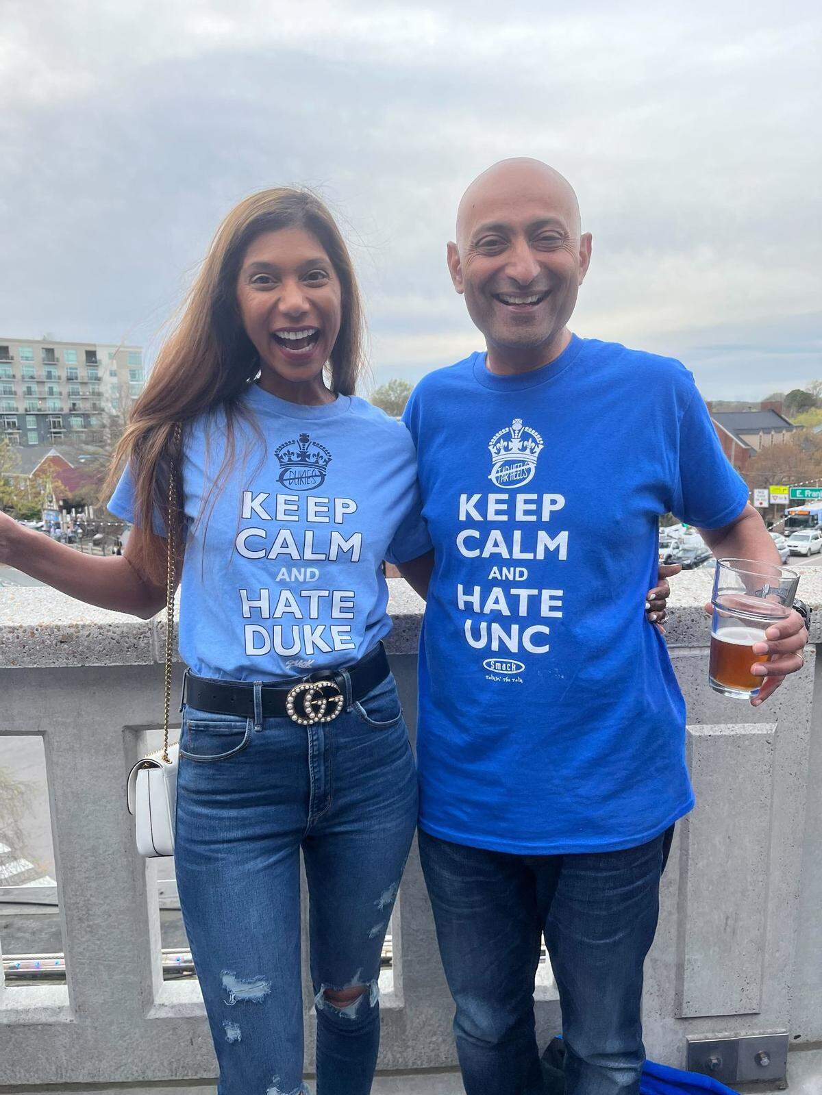 Anu and Uttam Reddy of Austin, Texas, flew to the Triangle to cheer on their alma maters (UNC for her, Duke for him). They watched the Duke-UNC Final Four game at the Top of the Hill Restaurant and Brewery in Chapel Hill on April 2, 2022.