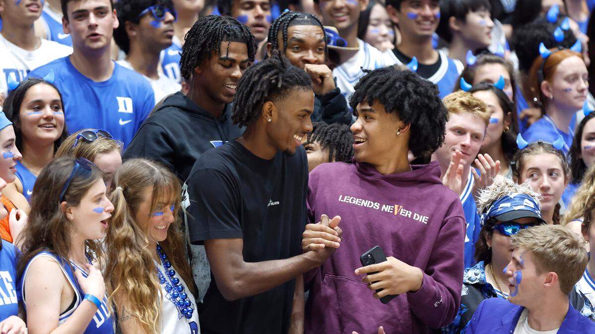 Duke basketball commit Mackenzie Mgbako, bottom left, greets recruit Dylan Harper, bottom right, as they stand with basketball commits Sean Stewart, top left, and Caleb Foster, top right, during Duke’s Countdown to Craziness at Cameron Indoor Stadium in Durham, N.C., Friday, Oct. 21, 2022.