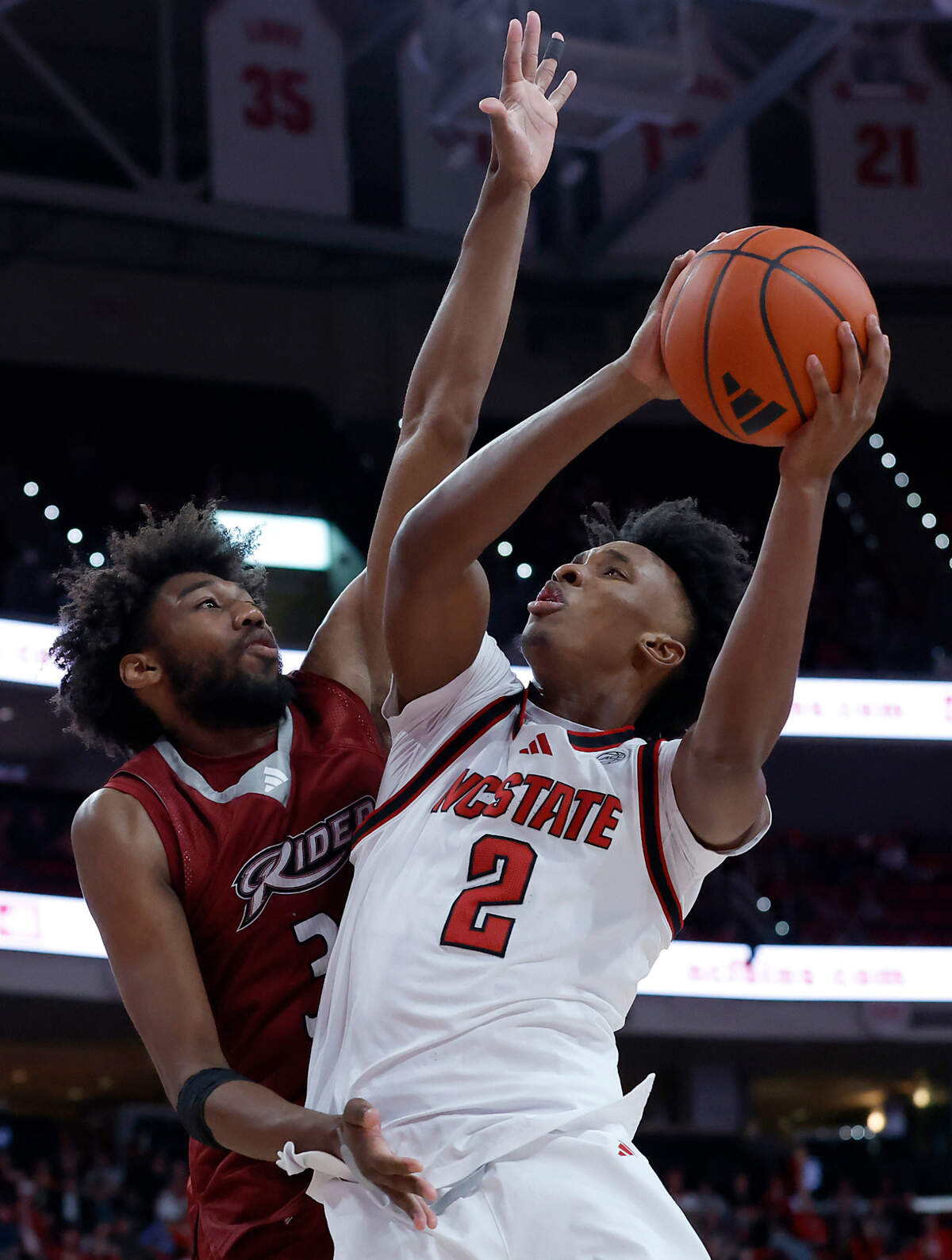 N.C. State’s Paul McNeil goes up for a shot against Rider’s T.J. Weeks Jr. during the second half of the Wolfpack’s 89-63 win on Sunday, Dec. 22, 2024, at Lenovo Center in Raleigh, N.C.