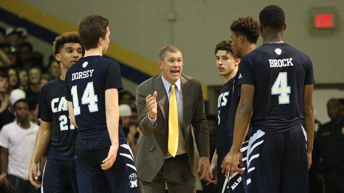 Millbrook’s coach Scott Mcinnes instructs his team in a timeout during the Garner Magnet Trojans high school basketball game with the Millbrook Wildcats in the fourth round 4A Boys Basketball Playoffs, Tuesday, March 1, 2016, in Garner, N.C. Garner won the game 92-88.