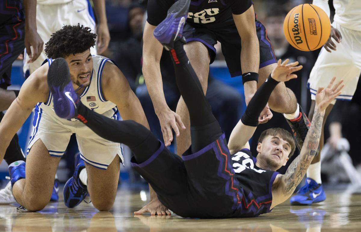 TCU guard Brock Harding (2) looks for an open teammate after recovering a loose ball in the second half against Duke on Saturday, March 21, 2026, during the second round of the NCAA Tournament at Bon Secours Arena in Greenville, S.C.