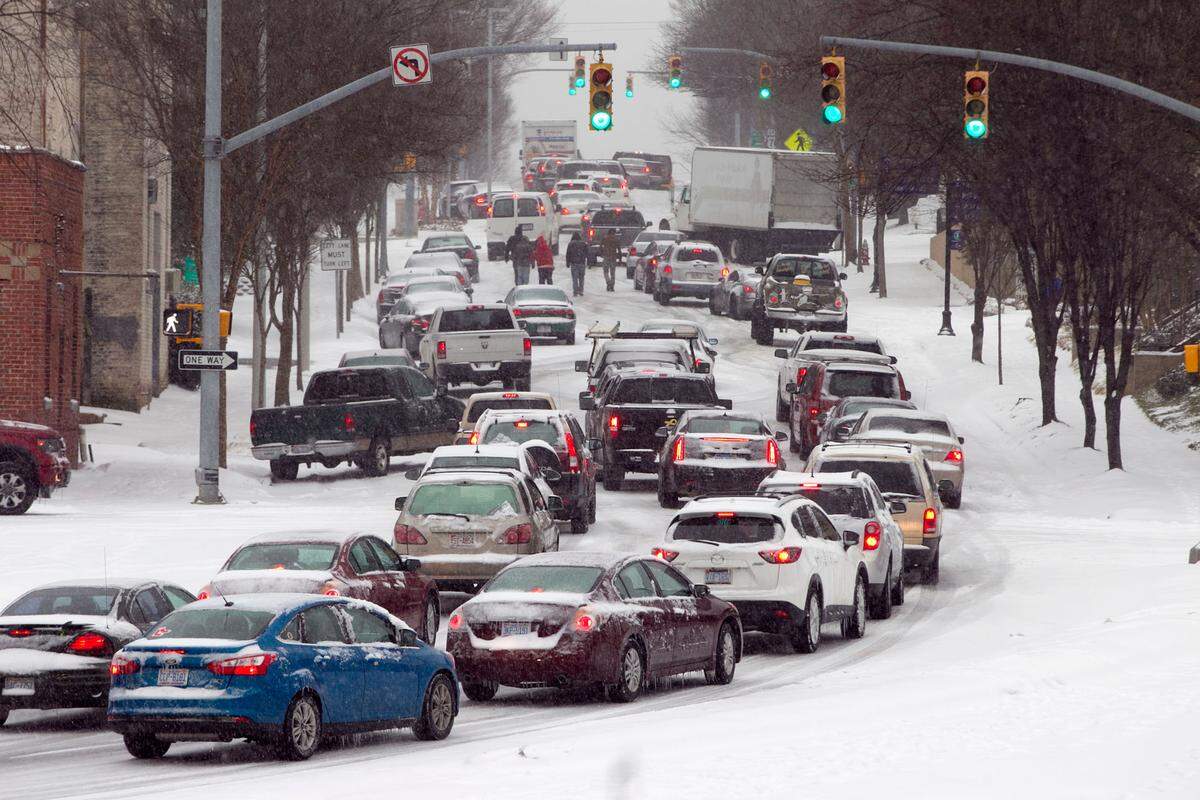 Inbound Dawson Street is littered with traffic after some folks abandoned their cars trying to enter downtown during a winter storm just before 4 pm on Wednesday February 12, 2014.