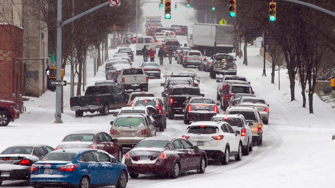 Inbound Dawson Street is littered with traffic after some folks abandoned their cars trying to enter downtown during a winter storm just before 4 pm on Wednesday February 12, 2014.